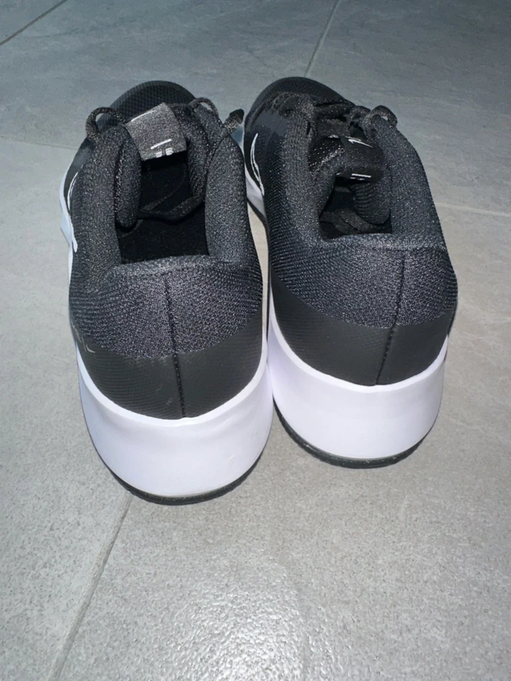Nike Black Athletic Shoes with White Swoosh